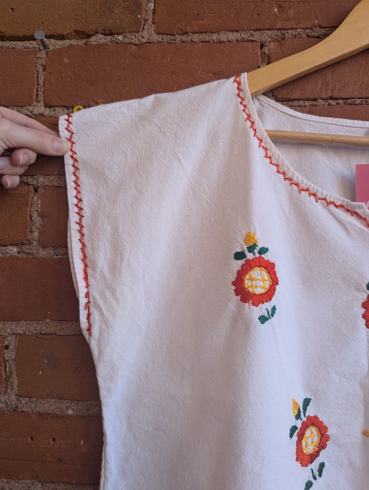 White Cotton V-Neck Blouse With Hand-Embroidered Orange and Yellow Flowers