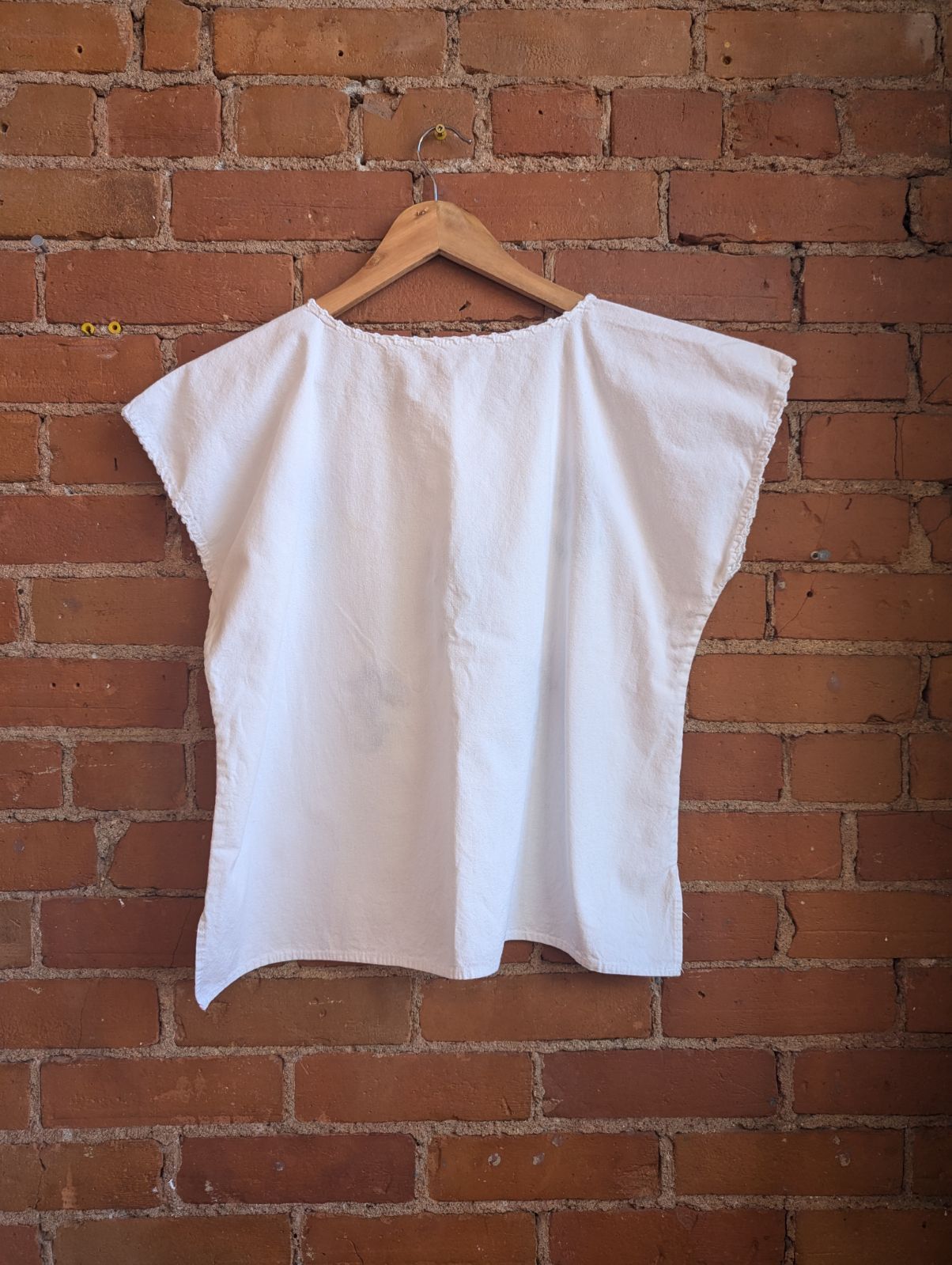 White Cotton V-Neck Blouse With Hand-Embroidered Orange and Yellow Flowers